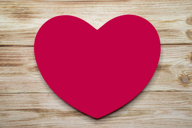 istock Red heart on wood 1293616958