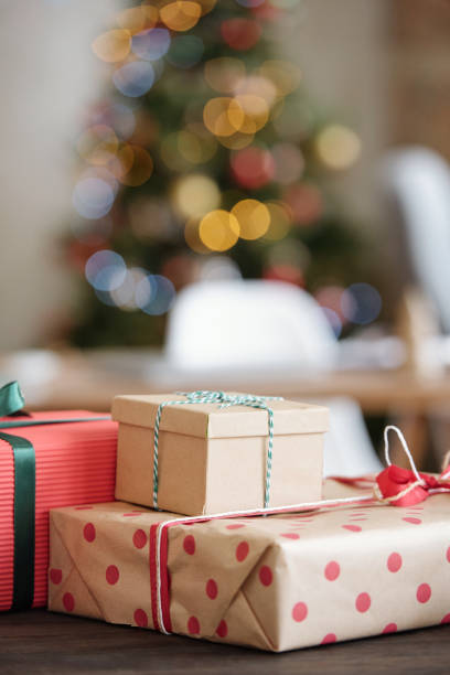 istock Several packed Christmas gifts wrapped into paper and bound with ribbons 1293617084