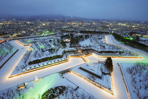 Hakodate, Japan at Fort Goryokaku Hakodate, Japan - February 3, 2017: Overlooking Fort Goryokaku on a winter evening. The star fort was built in 1855 and served as the main fortress for the short-lived Republic of Ezo. hakodate stock pictures, royalty-free photos & images