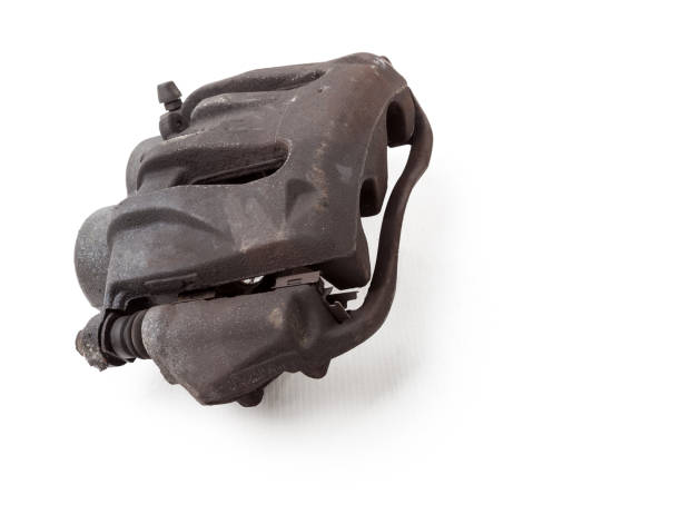 istock Old metal brake caliper on a white background in a photo studio for replacement during the repair of the chassis or for a catalog of spare parts for sale on auto parsing. 1293619056