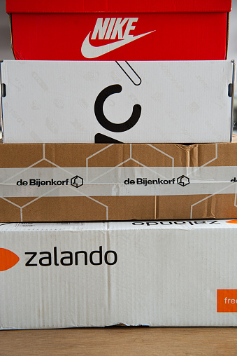Amsterdam, Jisperveldstraat, the Netherlands, 12-29-2019. Zalando, de bijenkorf package ready to send back, sealed box, online shopping, return to sender, retail, e-tail, Nike shoe box,