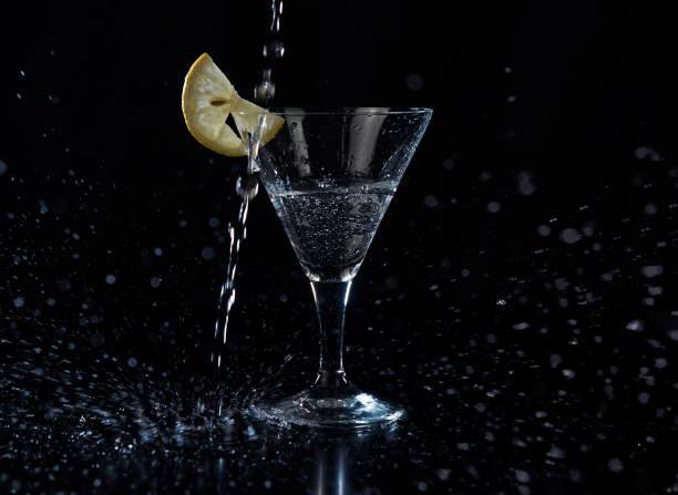 istock Fill up a martini glass cocktail with citrus fruit 1293620280