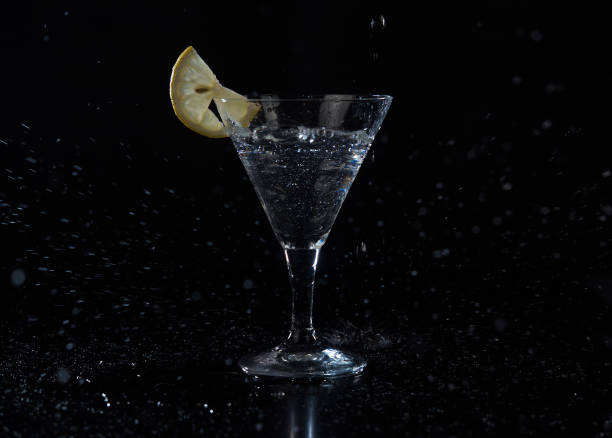 istock Fill up a martini glass cocktail with citrus fruit 1293620310