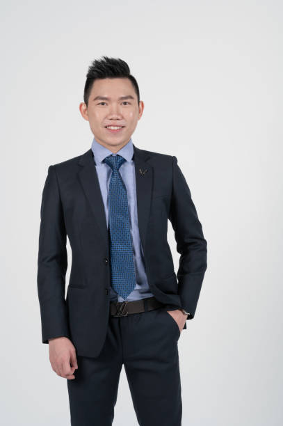 istock Asian Chinese young businessman with coat in white background studio 1293621473