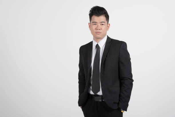 istock Asian Chinese young businessman with coat in white background studio 1293621475