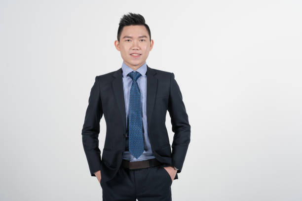 Asian Chinese young businessman with coat in white background studio