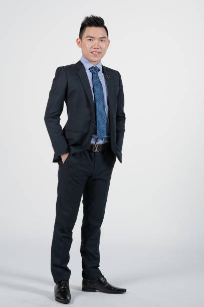 istock Asian Chinese young businessman with coat in white background studio 1293621505