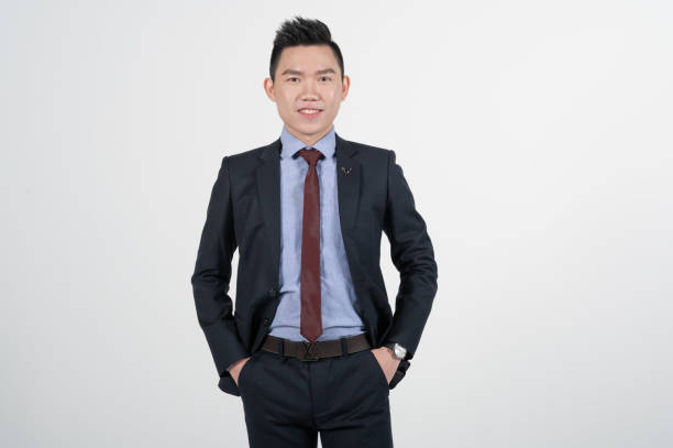 istock Asian Chinese young businessman with coat in white background studio 1293621518