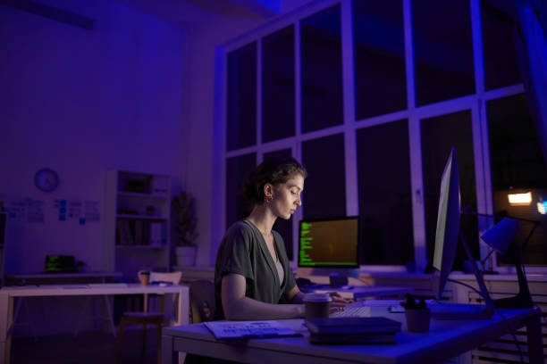 istock Woman Working At Night In Office 1293624390