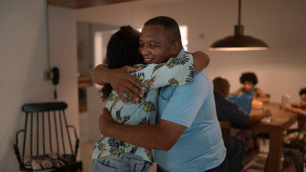 istock Father embracing daughter at home 1293624392