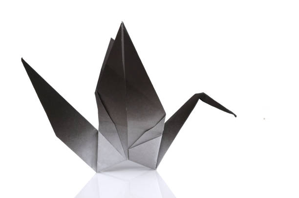 istock A crane origami paper bird isolated white 1293624405