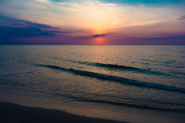 istock Sunset over the calm sea 1293628987