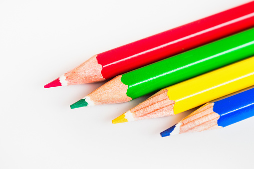 multi-colored pencils on multi-colored background, Close up, copy space, Modern art. Modern design isolated