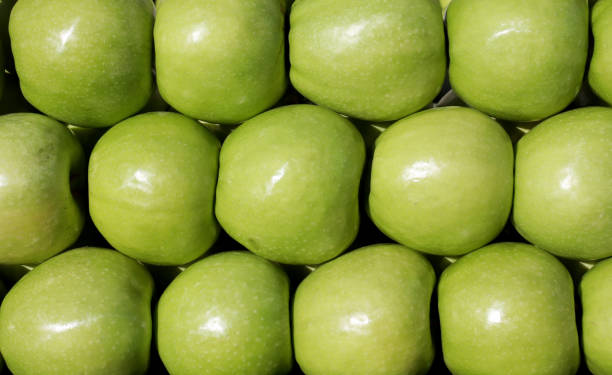 istock green apples on the market 1293633139