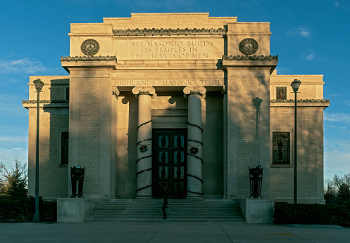 View of the Highlands Masonic Temple in Denver, Colorado, at sunset. Highlands Masonic Lodge was designed by brothers Merrill and Burnham Hoyt in 1927, listed on the National Register of Historic Places in 1995.