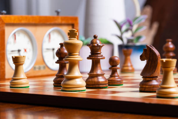 chess game strategic chess game on wooden chess board chess timer stock pictures, royalty-free photos & images