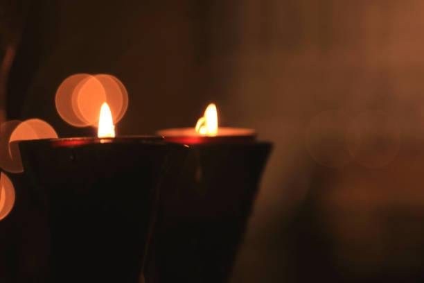 istock Burning candles and their light with a blurred background 1293634592