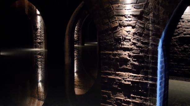 Underground Ancient Room with Brick Walls and Vaulted Arched Ceiling