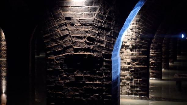 istock Underground Ancient Room with Brick Walls and Vaulted Arched Ceiling 1293635795