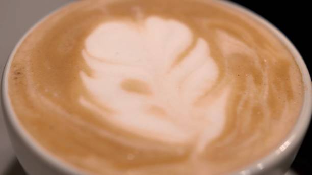 istock Serving Cappuccino Coffee Cup with Frothy Milk Latte Art 1293636663