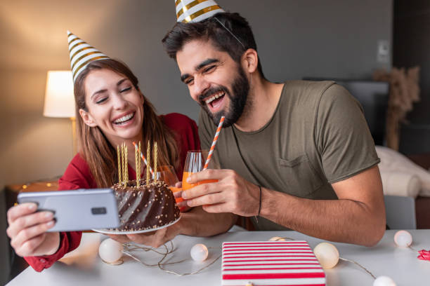 istock Happy couple on a video call, celebrating birthday 1293636943
