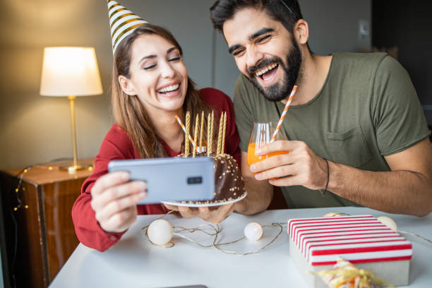 istock Happy couple on a video call, celebrating birthday 1293637609