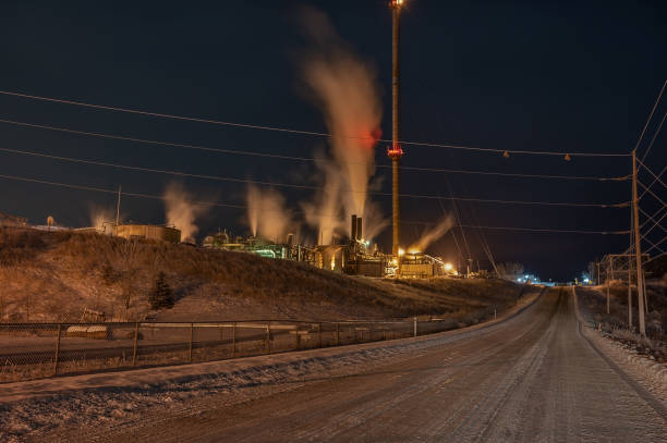 Gas Plant near Cochrane Night view of a gas plant near Cochrane, Alberta, Canada cochrane alberta photos stock pictures, royalty-free photos & images