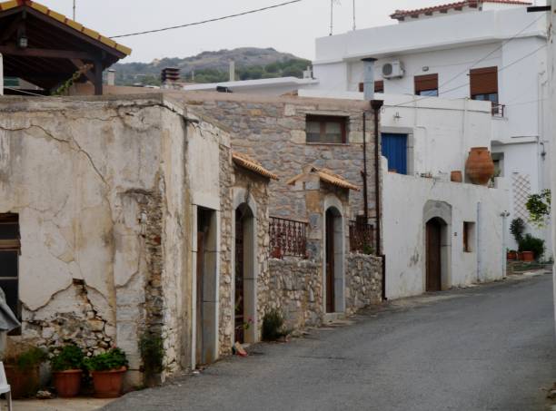 istock Road through Greek village 1293641141