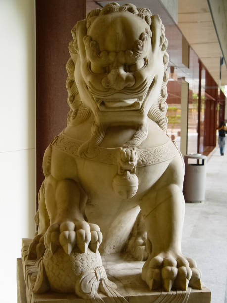 stone lion at the door of the entrance to the building. a symbol of lion protection. - bangkok province photography construction architecture imagens e fotografias de stock