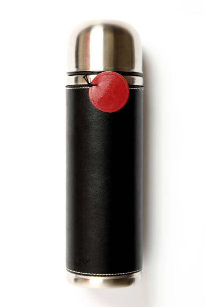 Stainless steel thermos with black leather cover isolated on white background.