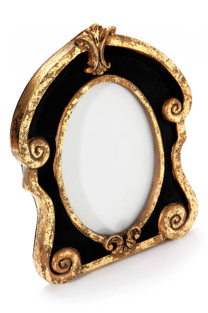 istock Vintage black art frame with gold decorations and oval image space isolated on white background 1293642064