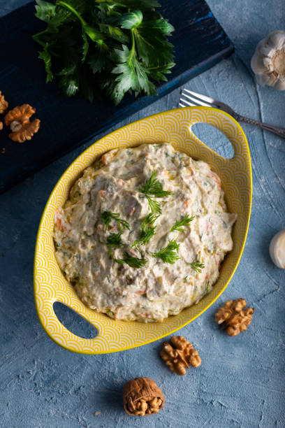 istock Carrot and celery salad with yogurt and walnut. 1293642225