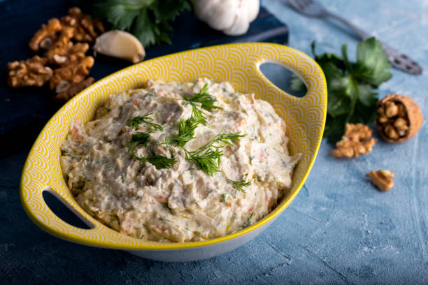 istock Carrot and celery salad with yogurt and walnut. 1293642369
