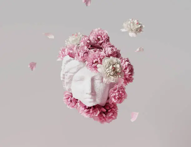 Photo of 3D Ancient woman Statue, white broken stone. Greek,roman  goodness style. Head sculpture pink flowers bouquet on gray background. Nature, Peonies, falling petals. Feminine beauty  abstract 3D render.