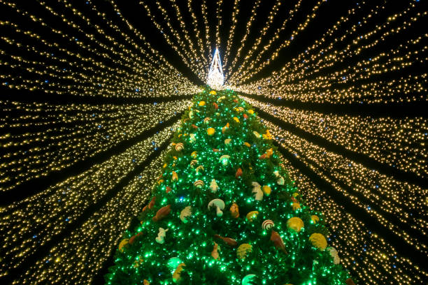 istock Christmas tree covered with garlands ribbons 1293644241