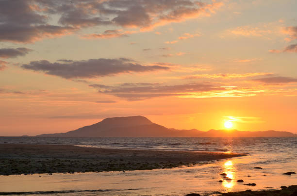 Sun setting off the coast of county Mayo,Ireland. stock photo