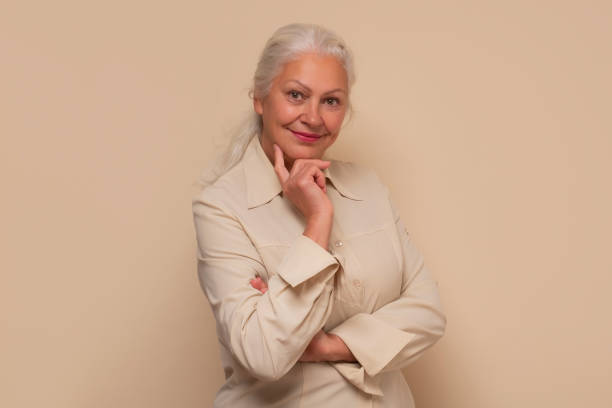 istock Smiling senior woman smiling looking at camera. 1293648084