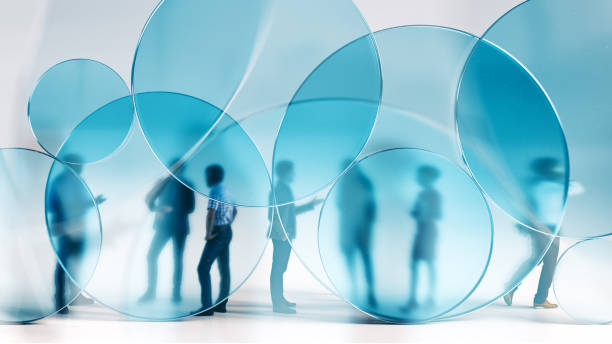 People behind blue glass circles stock photo