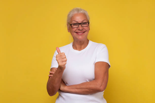 istock Active elderly woman holding her thumb up 1293649470