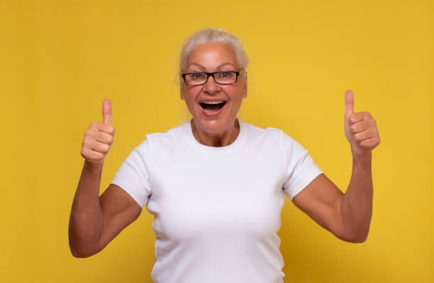 istock Active elderly woman holding her thumb up 1293649525