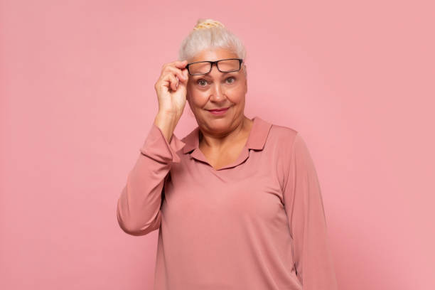 istock Smiling senior woman wearing eyesight smiling looking at camera. 1293650664