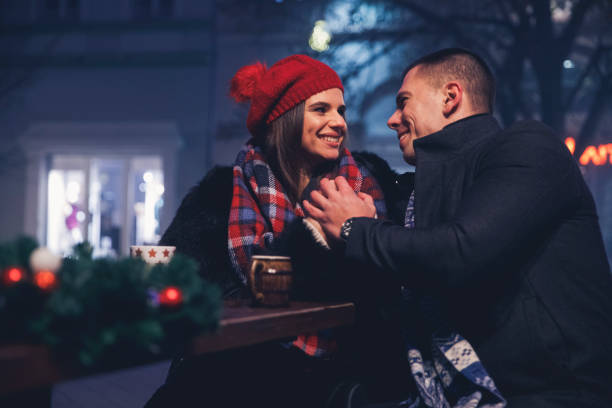 istock Holding hands and keeping warm on a winter eve date 1293655691