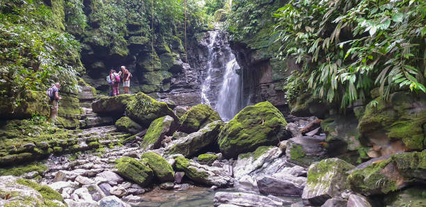 istock Small group of people at the waterfall 1293656605