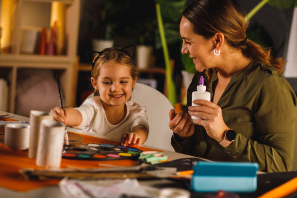 istock Mother and daughter bonding while doing arts and crafts together 1293656821