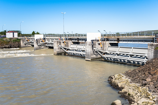 Small Hydroelectric power station along a river in Iceland and clear sky in summer