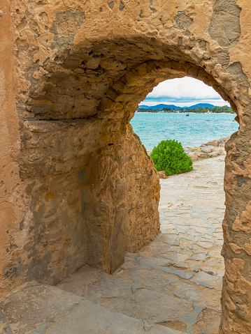 Arched passage to the sea in the stone wall of the ancient fortress. Wall of medina in Hammamet, Tunisia, znorth Africa
