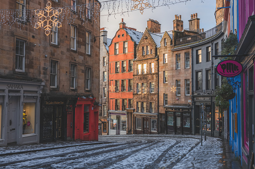 Edinburgh's colourful Victoria Street on a December's morning after a light overnight snowfall.