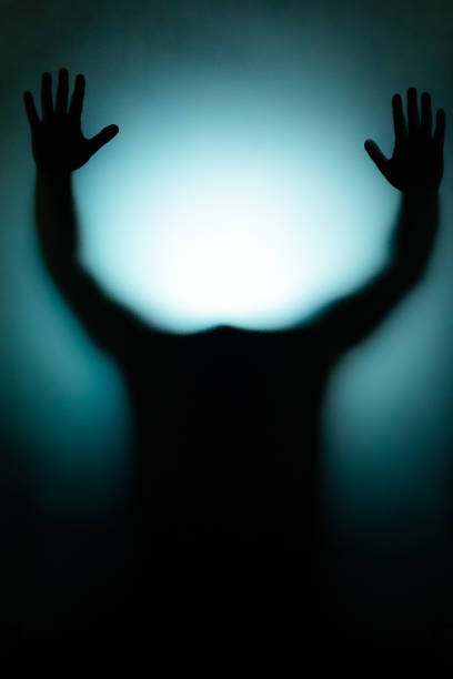 istock Athens, Greece - April 22, 2018: Silhouette behind the glass 1293671080