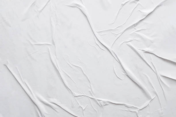 istock Blank white crumpled and creased paper poster texture background 1293671127