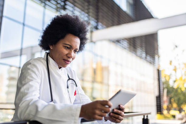 istock Female doctor working on digital tablet. 1293673034